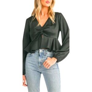 black "All in Favor Tie Front Satin Peplum Top" with a V-neck and long sleeves.